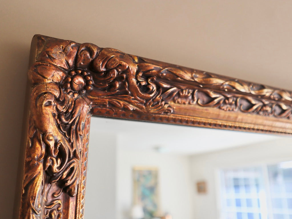 1970s Carved Floral Wood Mirror Finished in Gold Gilt